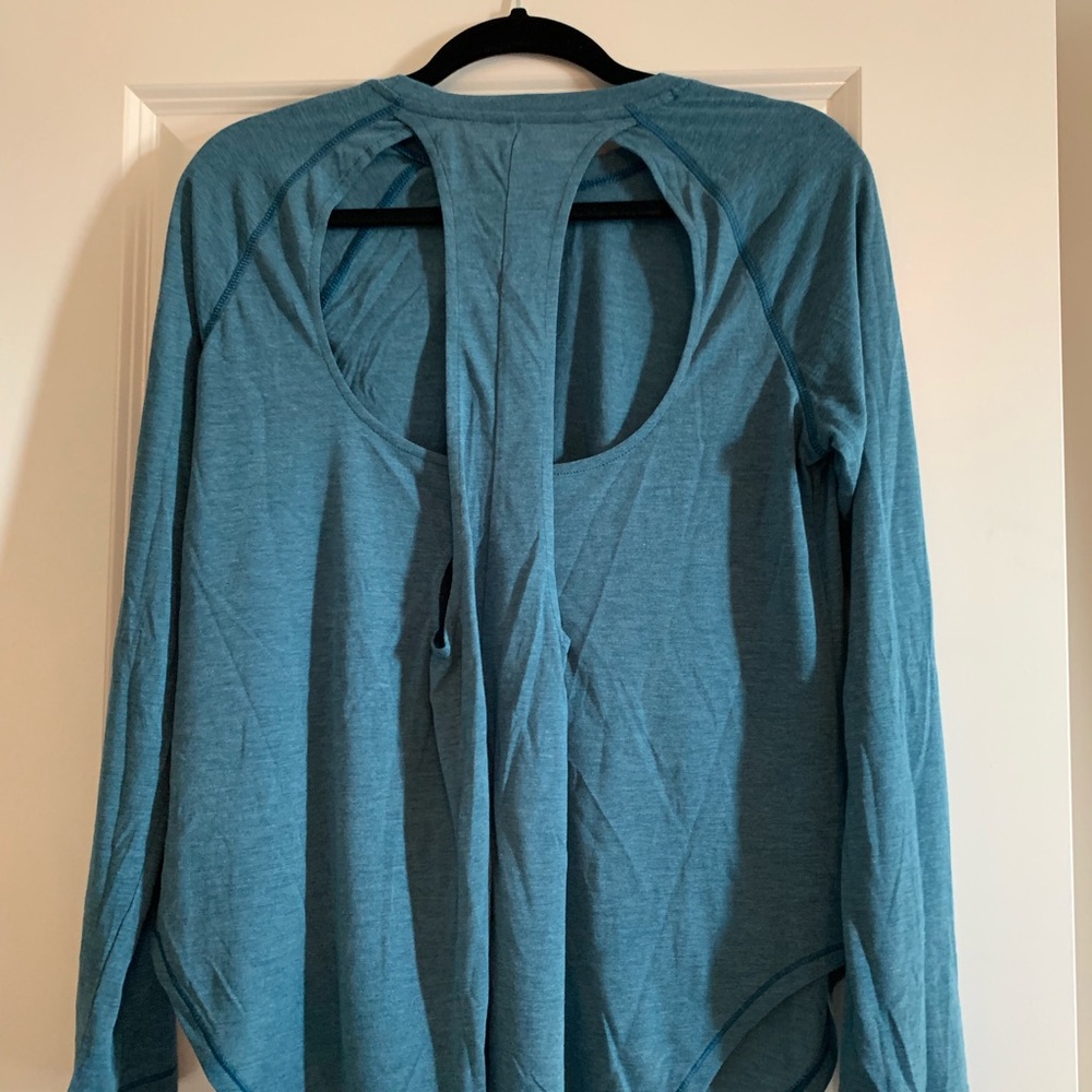 Under Armour tee with cutout back. New with tags.